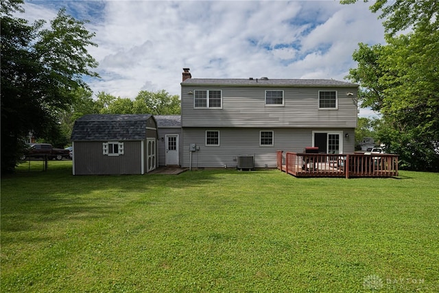 2547 Ryan Ct, Beavercreek, OH 45434 - rear view of property featuring a chimney, a deck, a lawn, and cooling unit