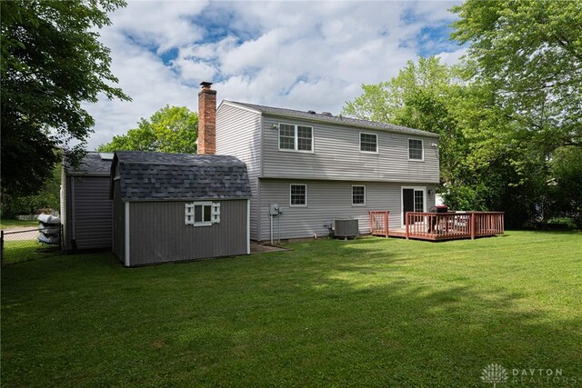 2547 Ryan Ct, Beavercreek, OH 45434 - back of property featuring central AC unit, a deck, a chimney, and a shingled roof