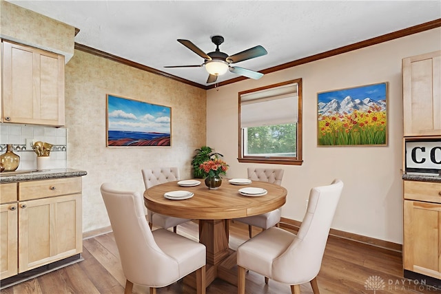 560 Roselake Dr, Centerville, OH 45458 - dining area featuring dark wood finished floors, baseboards, a ceiling fan, and crown molding