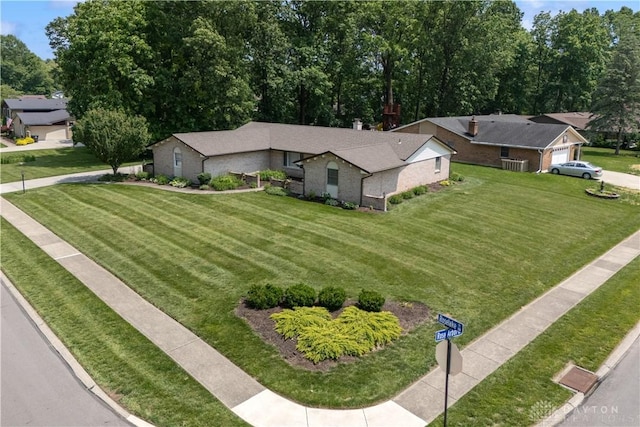 560 Roselake Dr, Centerville, OH 45458 - view of front of house with a front yard and brick siding