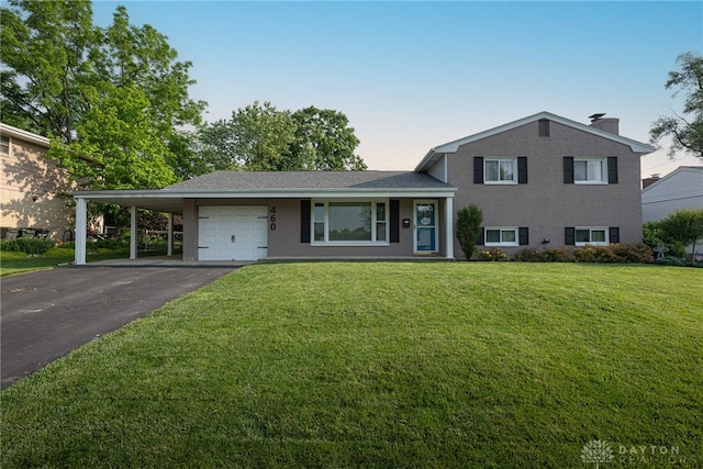 460 Rader Dr, Vandalia, OH 45377 - tri-level home featuring driveway, an attached garage, a front lawn, an attached carport, and a chimney