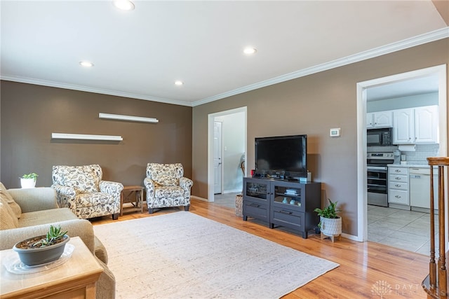 460 Rader Dr, Vandalia, OH 45377 - living area with ornamental molding, baseboards, recessed lighting, and light wood-style floors