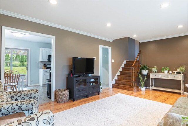 460 Rader Dr, Vandalia, OH 45377 - living area featuring ornamental molding, stairway, recessed lighting, and light wood finished floors