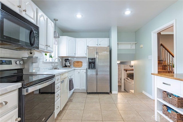 460 Rader Dr, Vandalia, OH 45377 - kitchen with appliances with stainless steel finishes, a sink, tasteful backsplash, white cabinets, and recessed lighting
