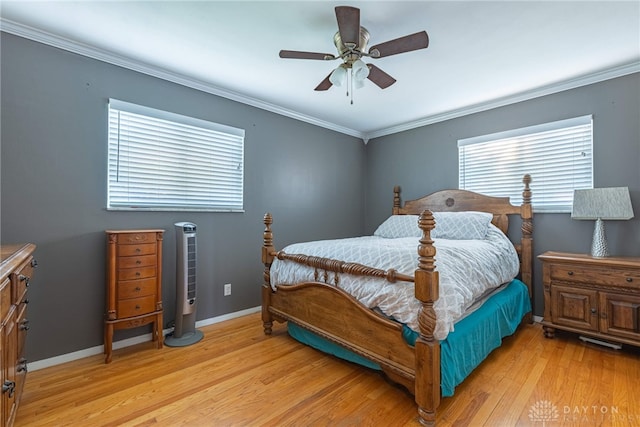 460 Rader Dr, Vandalia, OH 45377 - bedroom with light wood-type flooring, crown molding, baseboards, and ceiling fan