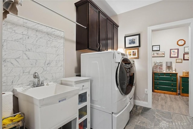 1215 Bourdeaux Way, Clearcreek Twp, OH 45458 - laundry room featuring separate washer and dryer, cabinet space, and baseboards
