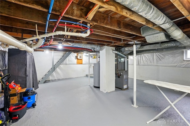 2755 S Blvd, Dayton, OH 45419 - unfinished basement featuring gas water heater, heating unit, and stairs