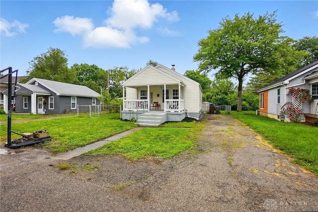 2755 S Blvd, Dayton, OH 45419 - view of front facade featuring a porch, driveway, and a front yard