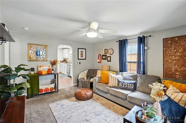 2755 S Blvd, Dayton, OH 45419 - living area with arched walkways, a ceiling fan, carpet flooring, and a textured ceiling