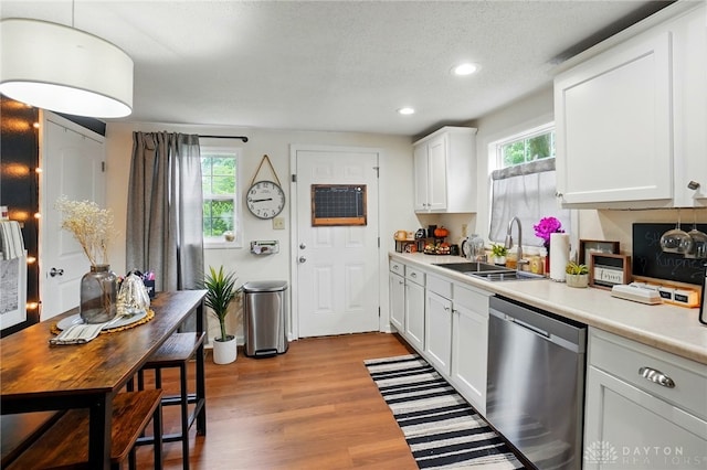 2755 S Blvd, Dayton, OH 45419 - kitchen with dishwasher, light countertops, recessed lighting, white cabinets, and light wood-style flooring