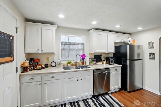2755 S Blvd, Dayton, OH 45419 - kitchen with stainless steel appliances, white cabinets, light wood-style flooring, light countertops, and recessed lighting