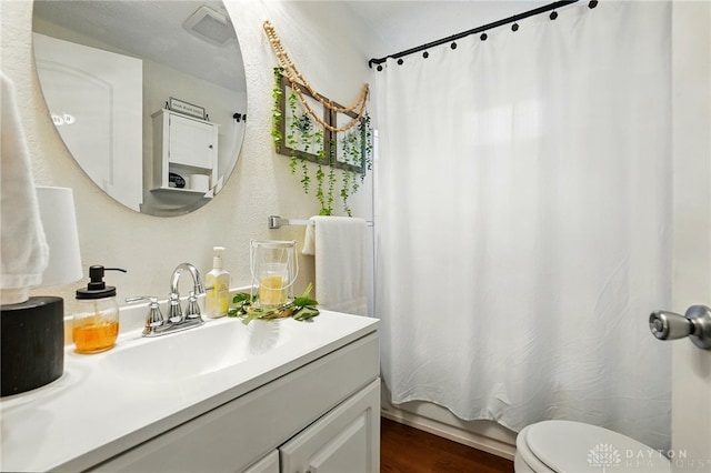 2755 S Blvd, Dayton, OH 45419 - full bath with vanity, wood finished floors, and shower / tub combo with curtain