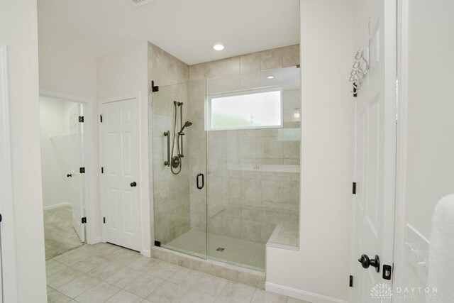 5053 Maiden Way, Liberty Twp, OH 45011 - full bathroom with a shower stall, tile patterned floors, baseboards, and a walk in closet