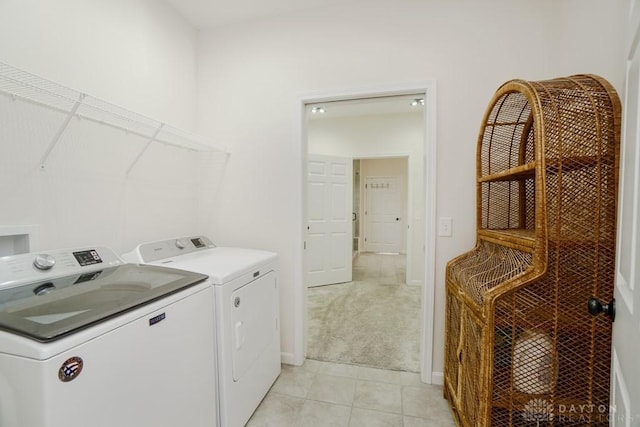 5053 Maiden Way, Liberty Twp, OH 45011 - washroom featuring independent washer and dryer, light tile patterned floors, light carpet, and baseboards