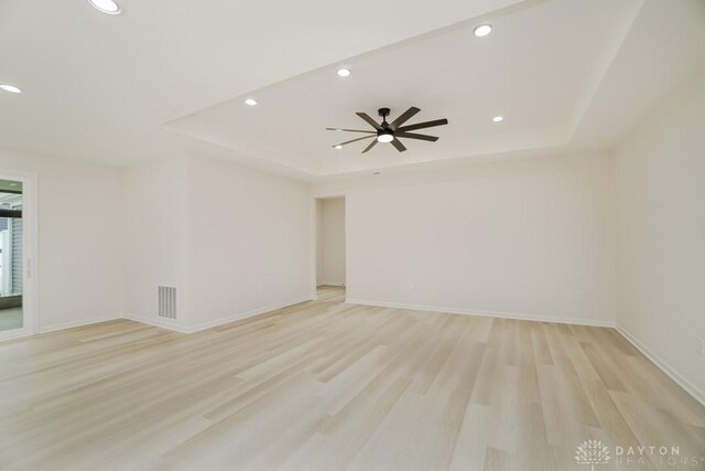5053 Maiden Way, Liberty Twp, OH 45011 - unfurnished room with a tray ceiling, recessed lighting, light wood-type flooring, ceiling fan, and baseboards