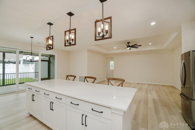 5053 Maiden Way, Liberty Twp, OH 45011 - kitchen featuring a chandelier, freestanding refrigerator, light wood-style floors, ceiling fan, and recessed lighting