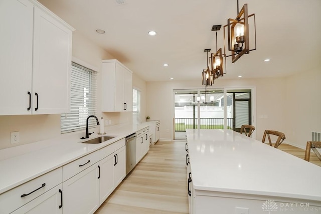 5053 Maiden Way, Liberty Twp, OH 45011 - kitchen with a sink, stainless steel dishwasher, a kitchen island, white cabinets, and recessed lighting