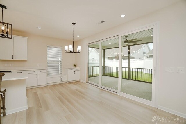 5053 Maiden Way, Liberty Twp, OH 45011 - unfurnished dining area with a chandelier, light wood-style floors, baseboards, and recessed lighting
