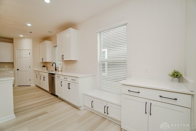 5053 Maiden Way, Liberty Twp, OH 45011 - kitchen featuring stainless steel dishwasher, white cabinetry, light wood-type flooring, recessed lighting, and light countertops
