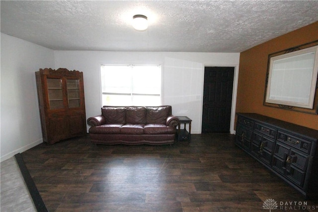6959 Edenton Pleasant Plain Rd, Wayne Twp, OH 45162 - living room with a textured ceiling, dark wood-style flooring, and baseboards