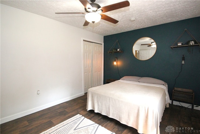 6959 Edenton Pleasant Plain Rd, Wayne Twp, OH 45162 - bedroom featuring a closet, a textured ceiling, wood finished floors, baseboards, and ceiling fan