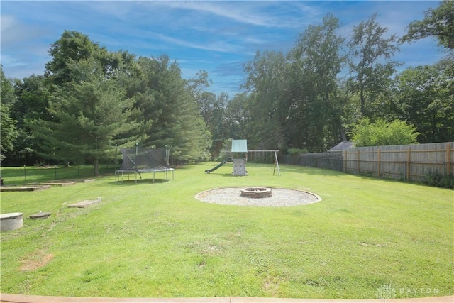 6959 Edenton Pleasant Plain Rd, Wayne Twp, OH 45162 - view of yard with a trampoline, an outdoor fire pit, and a playground