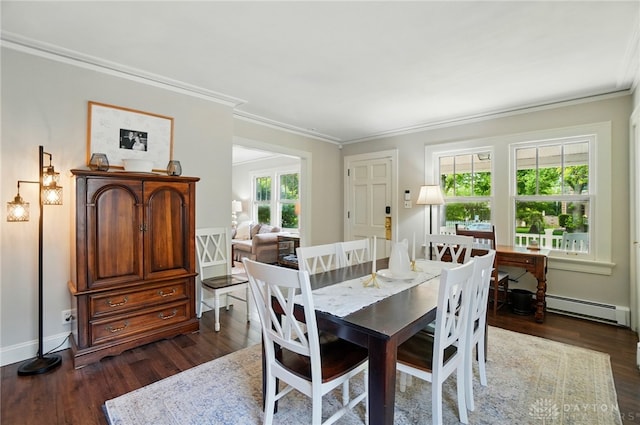 27 Spirea Dr, Oakwood, OH 45419 - dining room featuring a baseboard radiator, dark wood-style flooring, ornamental molding, and baseboards
