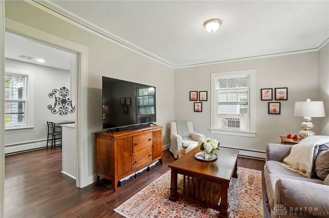 27 Spirea Dr, Oakwood, OH 45419 - living room with a baseboard heating unit, crown molding, healthy amount of natural light, and dark wood-style floors