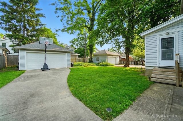 27 Spirea Dr, Oakwood, OH 45419 - view of yard with a detached garage, entry steps, and an outdoor structure