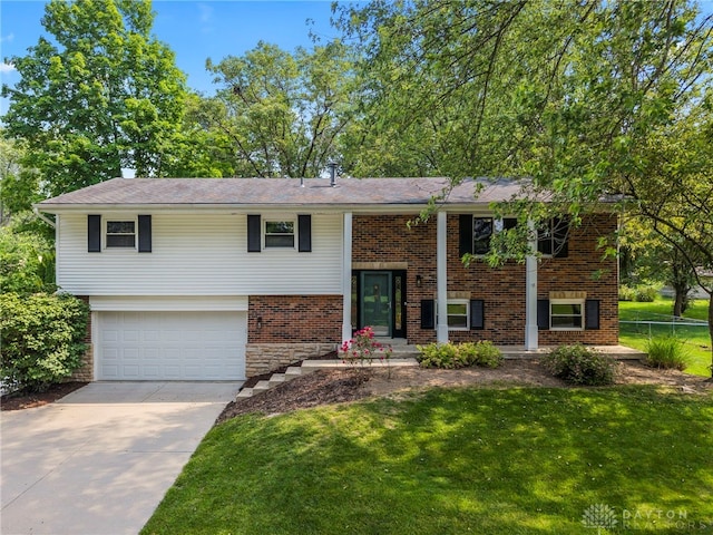 340 Marsha Jeanne Way, Dayton, OH 45458 - bi-level home with a garage, driveway, and brick siding