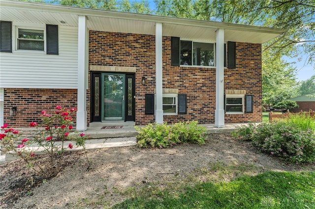 340 Marsha Jeanne Way, Dayton, OH 45458 - view of exterior entry with brick siding and covered porch