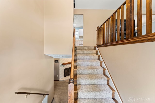 340 Marsha Jeanne Way, Dayton, OH 45458 - staircase featuring a fireplace and carpet flooring