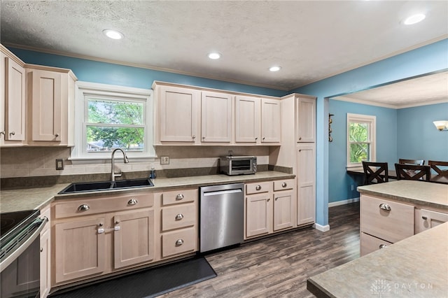 340 Marsha Jeanne Way, Dayton, OH 45458 - kitchen featuring appliances with stainless steel finishes, a sink, ornamental molding, plenty of natural light, and dark wood finished floors