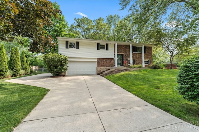 340 Marsha Jeanne Way, Dayton, OH 45458 - bi-level home featuring brick siding, driveway, and an attached garage