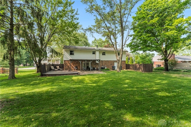 340 Marsha Jeanne Way, Dayton, OH 45458 - rear view of house featuring brick siding, a wooden deck, and a patio area