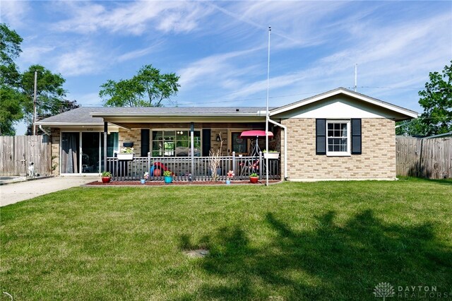 1032 Moccasin Trl, Xenia, OH 45385 - rear view of house featuring covered porch and brick siding
