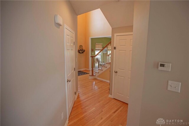 4560 James Madison Trl, Kettering, OH 45440 - corridor featuring light wood finished floors, stairway, and baseboards