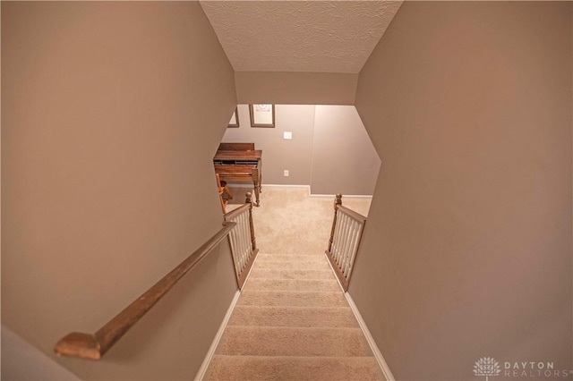 4560 James Madison Trl, Kettering, OH 45440 - staircase with carpet floors, a textured ceiling, and baseboards