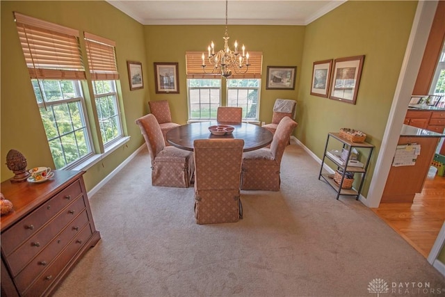 4560 James Madison Trl, Kettering, OH 45440 - dining space with a chandelier, plenty of natural light, baseboards, and ornamental molding