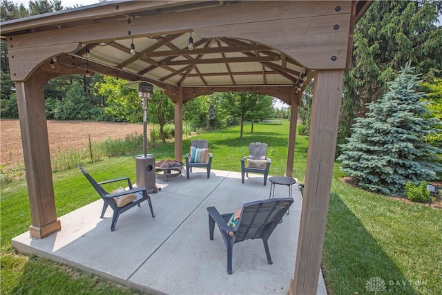 4560 James Madison Trl, Kettering, OH 45440 - view of patio featuring a fire pit and a gazebo