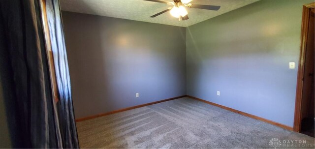 1261 Dusty Ln, West Alexandria, OH 45381 - spare room with a ceiling fan, carpet, and baseboards