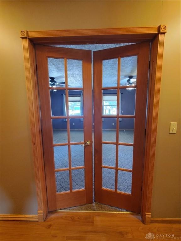 1261 Dusty Ln, West Alexandria, OH 45381 - detailed view of french doors, baseboards, and wood finished floors