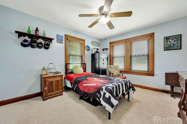 4975 Hamilton Eaton Rd, Hamilton, OH 45013 - bedroom featuring baseboards, light carpet, and ceiling fan