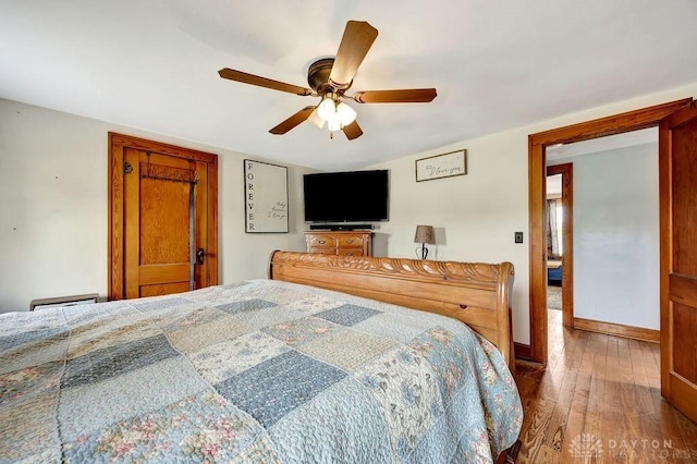 4975 Hamilton Eaton Rd, Hamilton, OH 45013 - bedroom featuring hardwood / wood-style flooring, baseboards, and a ceiling fan