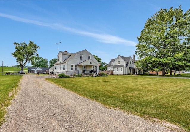 4975 Hamilton Eaton Rd, Hamilton, OH 45013 - view of front of property featuring dirt driveway, a chimney, and a front lawn