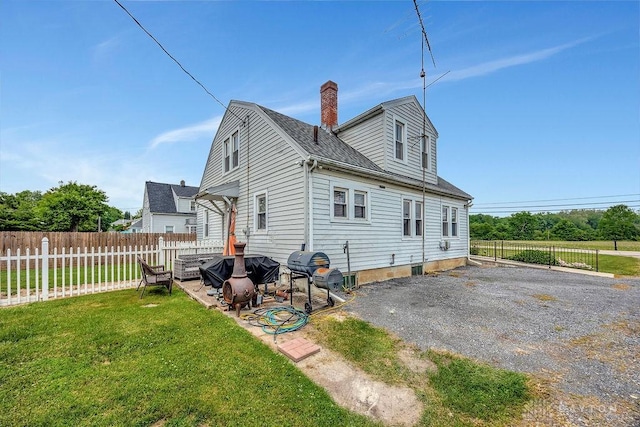 4975 Hamilton Eaton Rd, Hamilton, OH 45013 - rear view of property with a patio, a chimney, and roof with shingles