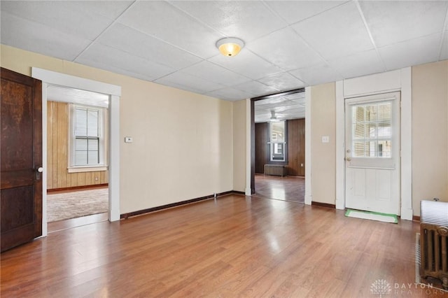 282 S W St, Xenia, OH 45385 - spare room featuring wood finished floors, radiator heating unit, and baseboards