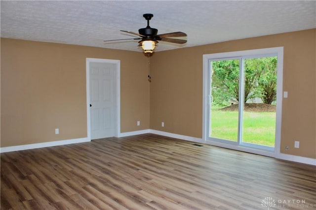 5317 Plainfield Rd, Dayton, OH 45432 - unfurnished room featuring baseboards, wood finished floors, ceiling fan, and a textured ceiling
