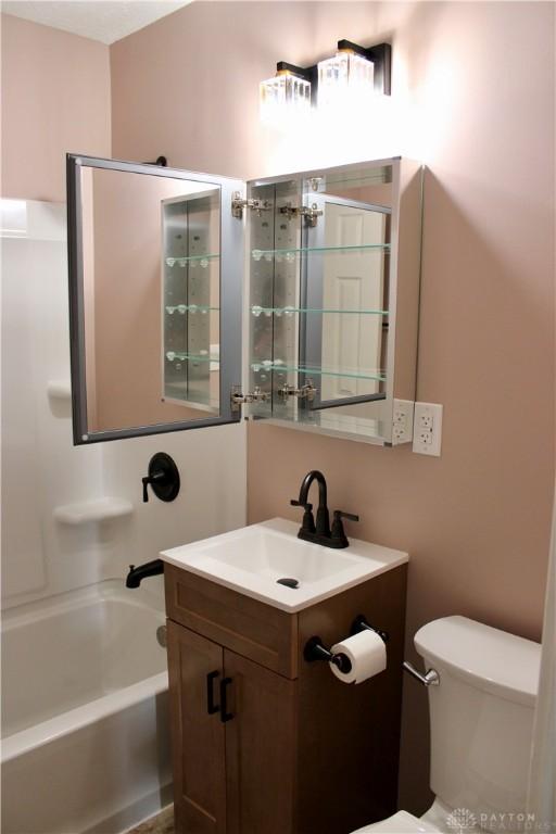 5317 Plainfield Rd, Dayton, OH 45432 - full bathroom with vanity, toilet, and tub / shower combination