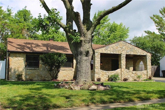 5317 Plainfield Rd, Dayton, OH 45432 - ranch-style house with stone siding and a chimney